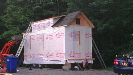 Sheathing completed. House wrap and tar paper done. Basically water tight.